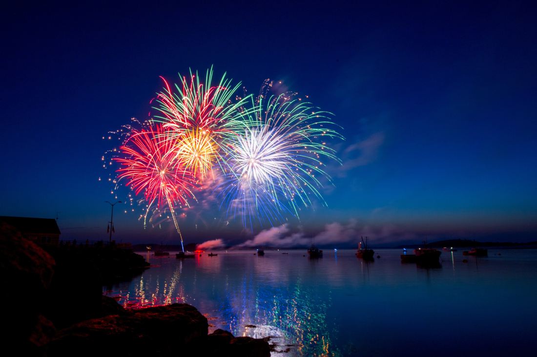 colourful fireworks over a lake